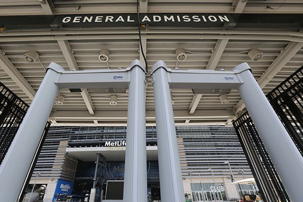 In this Thursday, May 28, 2015, photo, metal detectors stand at a gate at MetLife Stadium in East Rutherford, N.J. Beginning June 1, 2015, metal detectors were used to check people attending events at the stadium. (AP Photo/Julio Cortez)

