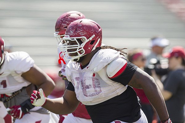 Arkansas defensive tackle Bijhon Jackson goes through warmups prior to a scrimmage Saturday, April 15, 2017, in Fayetteville. 