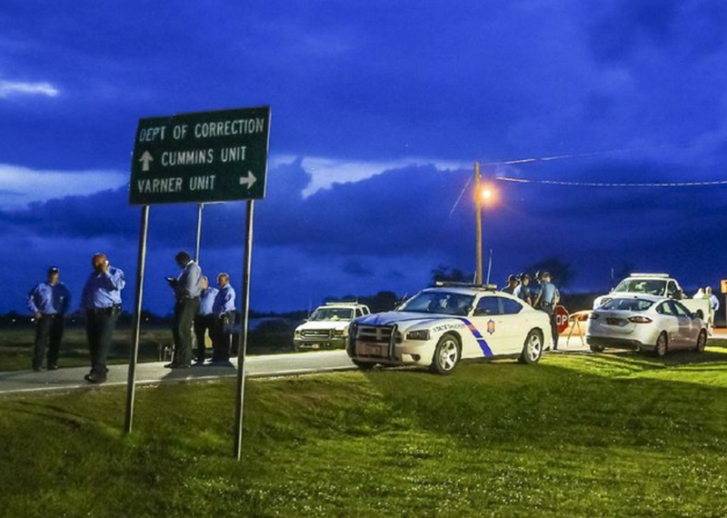 The sun sets behind clouds over an Arkansas State Police command post outside the Varner Unit near Grady on Monday evening, as officials await word on the status of an execution stay for condemned inmate Don Davis.
