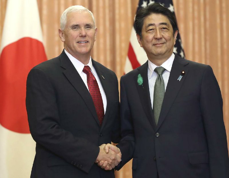 Vice President Mike Pence and Japanese Prime Minister Shinzo Abe meet Tuesday in Tokyo. Pence said the United States “will stand strongly with Japan” and other allies against North Korea.