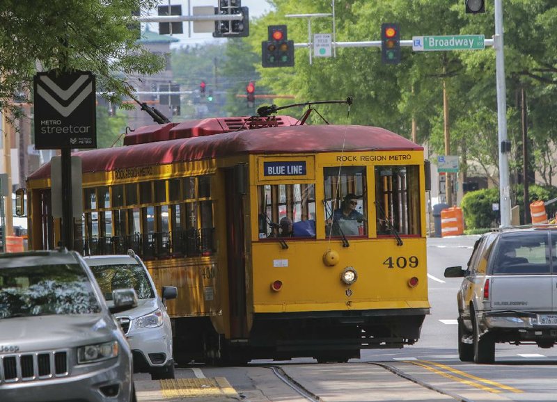 A Rock Region Metro trolley turns onto West Markham Street from Spring Street on Tuesday in downtown Little Rock.