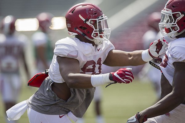 Arkansas linebacker Michael Taylor goes through practice Saturday, April 8, 2017, in Fayetteville. 