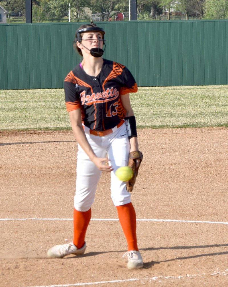 Photo by Mike Eckels Gravette&#8217;s Cally Kildow delivers a pitch over the plate during the April 14 Gravette-Berryville softball contest at Gravette High School softball field in Gravette.