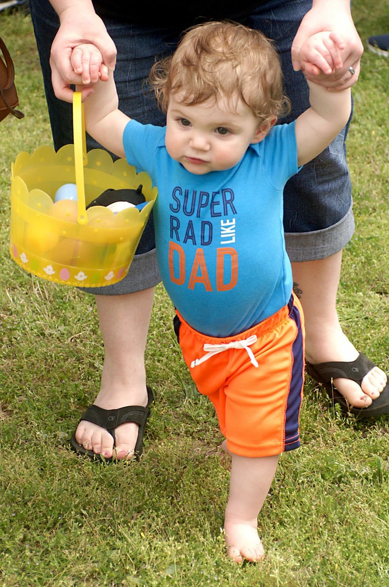 Photo by Randy Moll This youngster was enjoying a barefoot walk in the park grass following the Easter egg hunt in Gentry&#8217;s city park on Saturday (April 15, 2017).