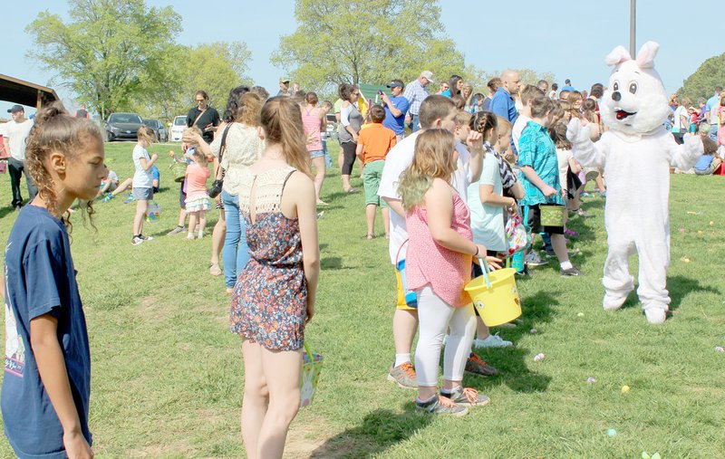 Keith Bryant/The Weekly Vista Kids in the 10-12 age group wait for the go-ahead to chase after eggs and other prizes during Saturday&#8217;s Easter egg hunt at Metfield Park.