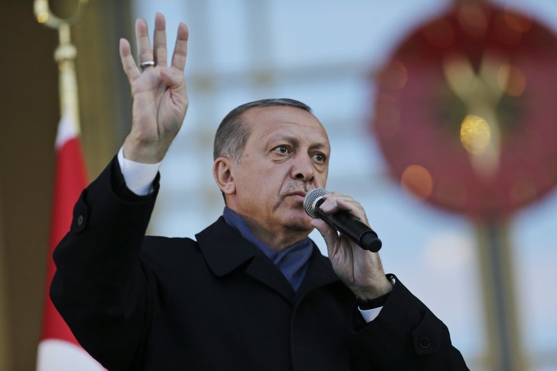 Turkey's President Recep Tayyip Erdogan, delivers a speech during a rally of supporters a day after the referendum, outside the Presidential Palace, in Ankara, Turkey, Monday, April 17, 2017. 