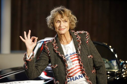 In this Dec. 10, 2013, file photo, model and actress Lauren Hutton poses for photos after arriving for Chanel's Metiers d'Art fashion show in Dallas. 