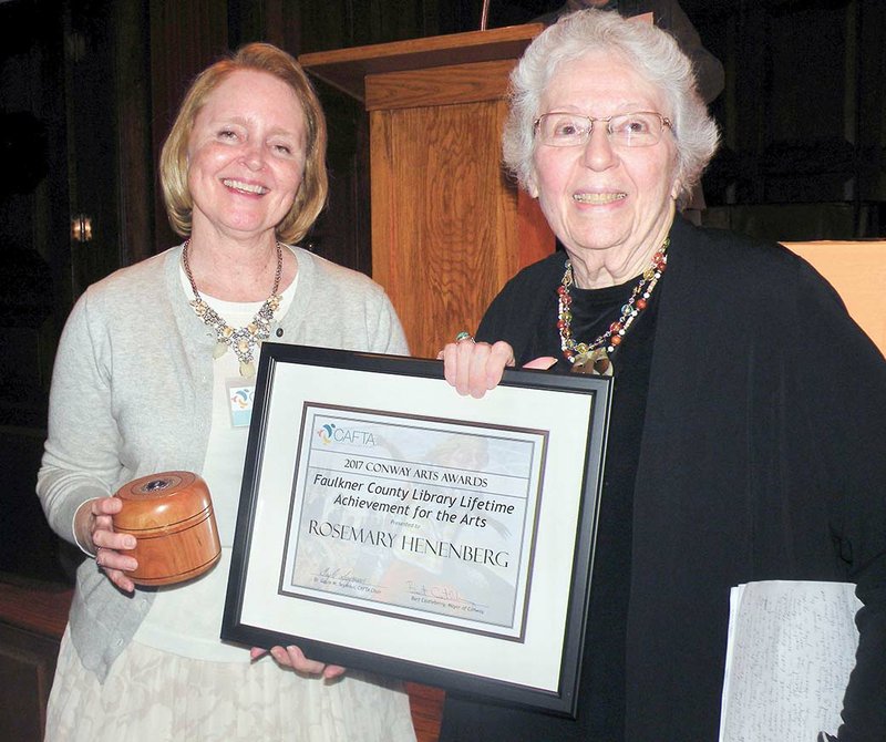 Rosemary Henenberg, right, receives the Faulkner County Library Lifetime 
Achievement for the Arts Award from Gayle Seymour, chairmwoman of the 
Conway Alliance for the Arts Board of Directors. Henenberg retired in 2012 from the theater arts department at Hendrix College, where she directed more than 
100 productions involving approximately 5,000 students.