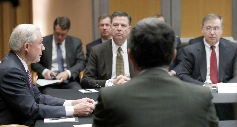 Attorney General Jeff Sessions (left) holds a meeting Tuesday in Washington that included FBI Director James Comey (center) and Drug Enforcement Administration acting chief Chuck Rosenberg (right).