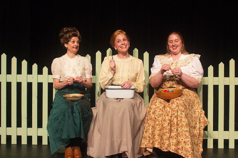 Desha County “residents” (from left) Kathryn Pryor (Maggie Jones), Karen Q. Clark (Irene Stroud), and Sarah Stankiewicz Dailey (Sallie Jones) sing a scene from During Wind and Rain at the Argenta Community Theater.
