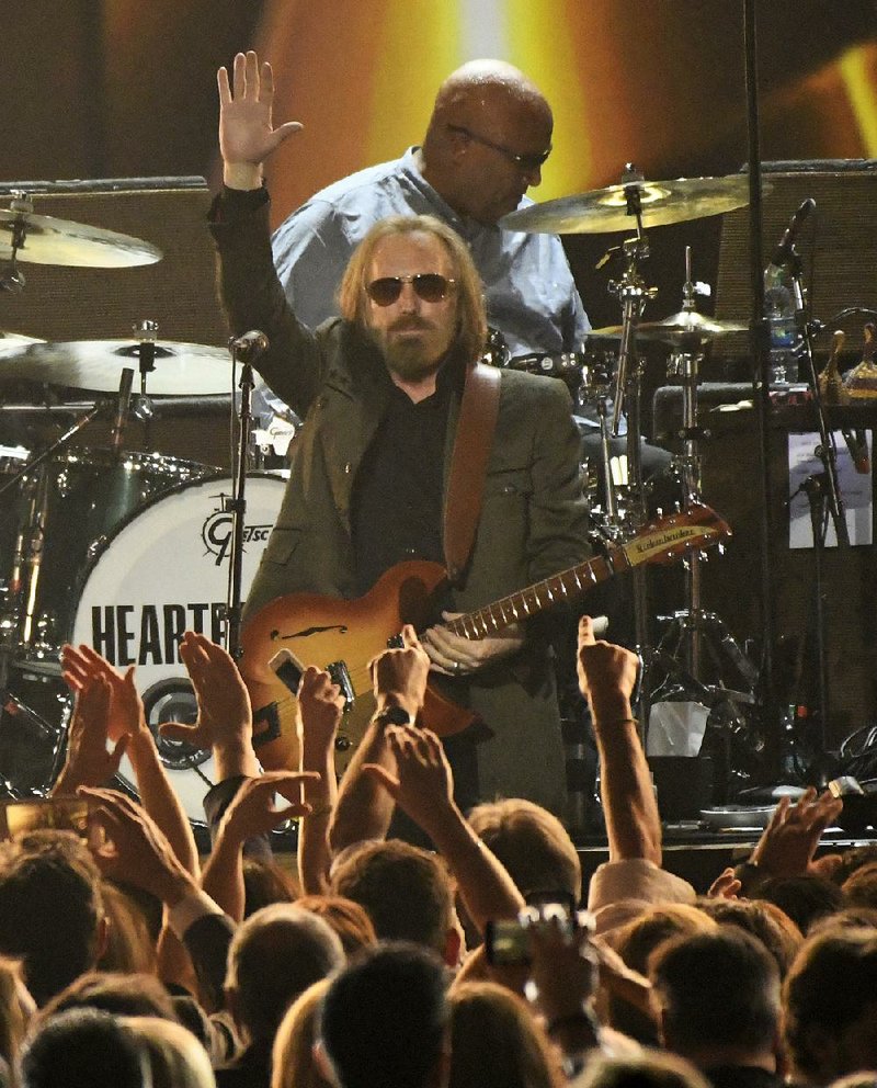 Tom Petty waves to the crowd at a Los Angeles concert in February.