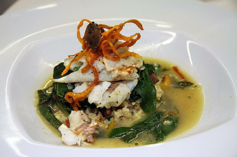 Mary Beth Ringgold’s Diamond Chef-winning dish: “freshwater bass served over a melange of wild mushrooms and spinach, nested over roasted vegetable couscous on a single leaf of Swiss chard, ladled with a reduction of fish stock, white wine and parmesan and dotted with white truffle oil, garnished with crispy, sweet potato spirals and a shaving of fresh truffle.”
