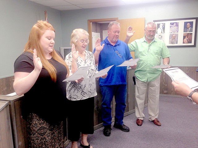 Sally Carroll McDonald County Press City Clerk Karla McNorton swears in, from left, Tax Collector Meghan Sexson, Alderman Alice Kezar, Alderman Ron Johnson and Mayor Greg Richmond.