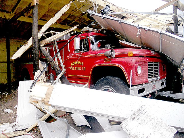 Photo submitted Firefighters with Goodman Fire Department have been working hard to dig out fire trucks buried in debris by the April 4 tornado that hit the town.