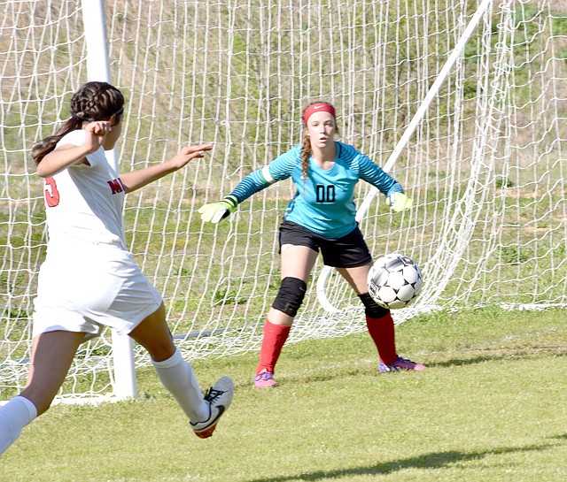 Photo by Rick Peck McDonald County&#8217;s Karla Barreda shoots and scores during the Lady Mustangs&#8217; 4-2 loss on April 11 at Loyce Shellnut Soccer Field in Anderson.
