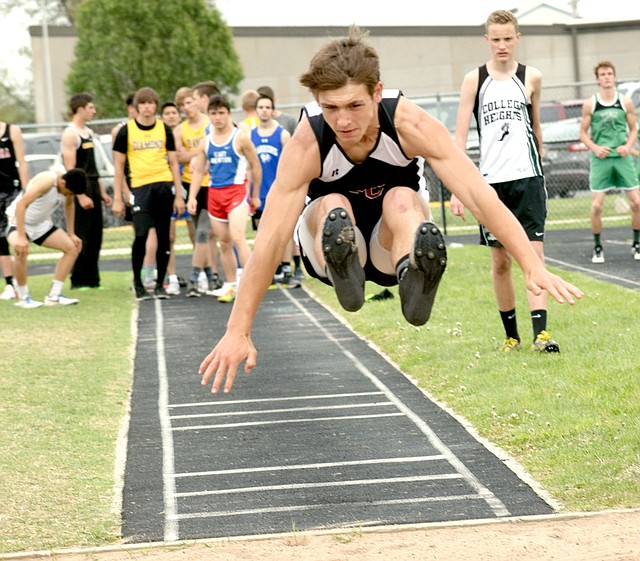 Photo by Rick Peck McDonald County freshman Jack Teague flies through the air with a leap of 18-7 in long jump to take fifth place at the East Newton Relays held April 13 at East Newton High School.
