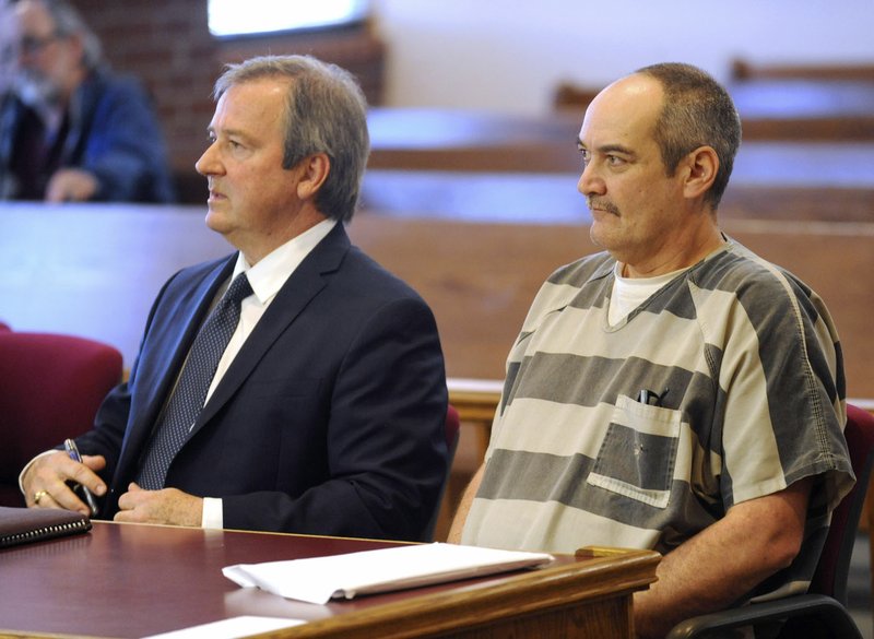  Attorney Mark Freeman (left) of Fayetteville sits with client James Vancleave April 4 in Mark Lindsay's courtroom in the Washington County Courthouse in Fayetteville.