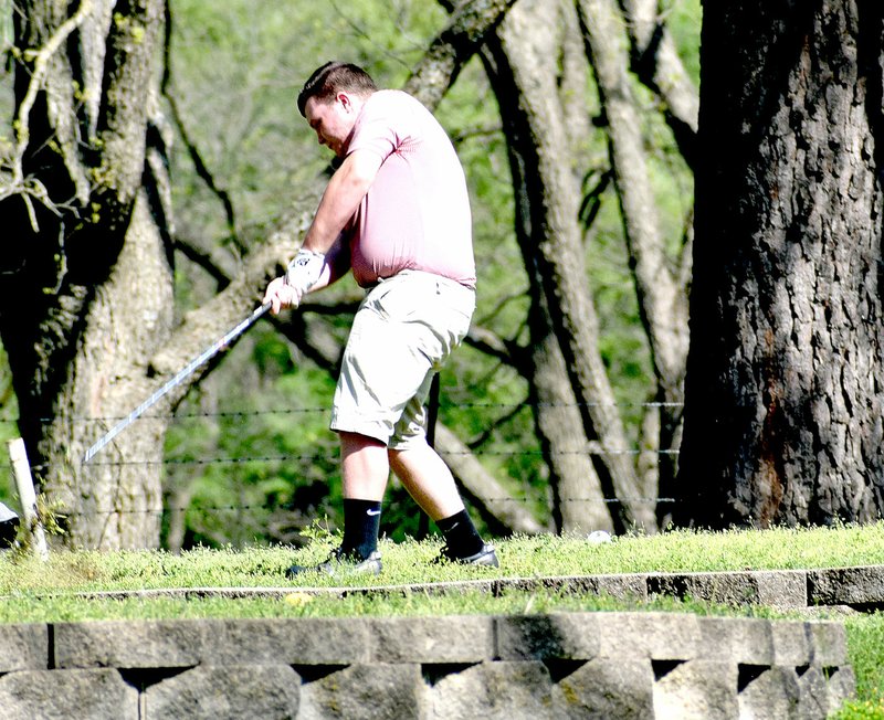 Photo by Rick Peck Blake Harrell tees off on hole number 7 at Elk River Golf Course in Noel on Tuesday. Harrell shot a 61 in the dual against the Neosho Wildcats.