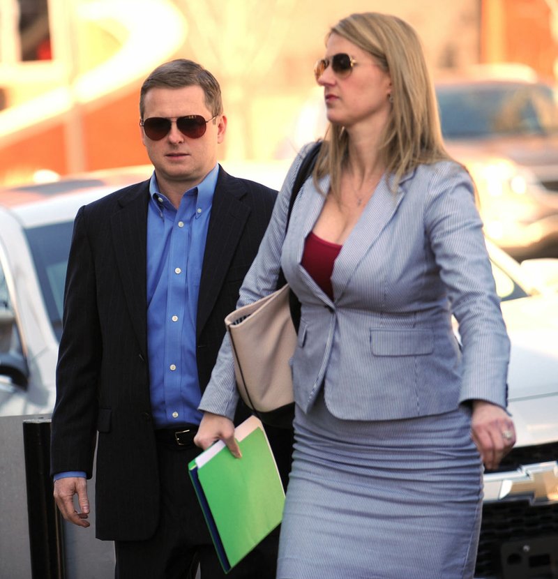 NWA Democrat-Gazette/ANDY SHUPE Randell Shelton Jr. and his attorney Shelly Koehler of Fayetteville walk into the John Paul Hammerschmidt Federal Building in Fayetteville for his original indictment March 28.