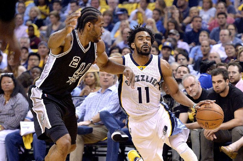 Memphis guard Mike Conley (right) tries to get around San Antonio forward Kawhi Leonard during Game 3 of their NBA Western Conference playoff series Thursday. The Grizzlies led by as many as 22 points in beating the Spurs 105-94.