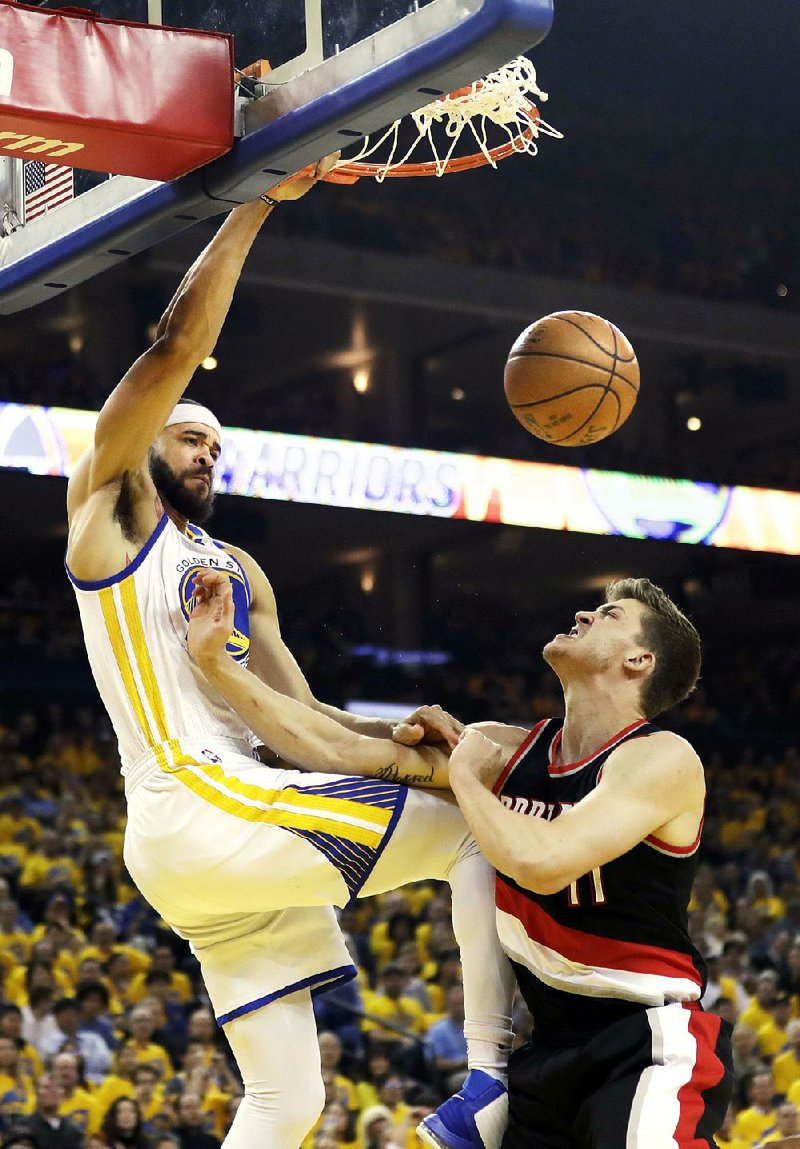 Golden State center JaVale McGee (left), stepping up several key players out for Wednesday’s game against Portland, had 15 points, 5 rebounds and 4 blocked shots to help the Warriors blow past the Trail Blazers 110-81 to grab a 2-0 lead in their NBA Western Conference playoff series.