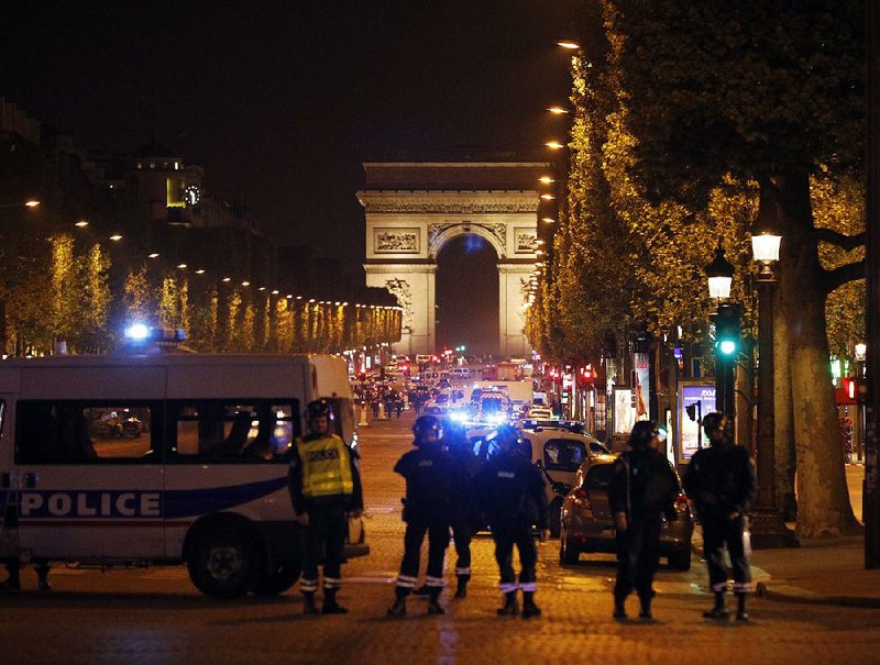 Police seal off the Champs Elysees in Paris after a gunman targeted police officers Thursday near a subway station.
