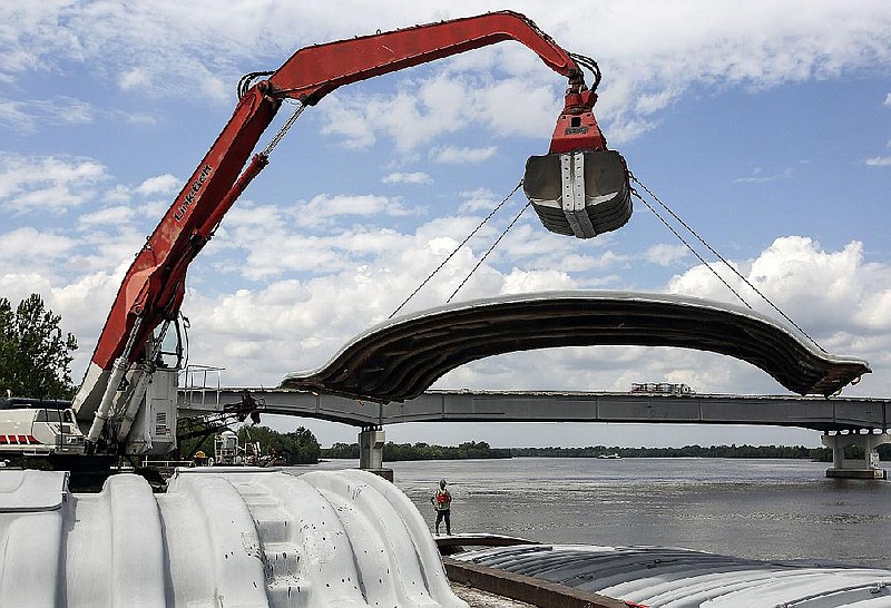 FILE — A crane lifts a cover into place for a barge at the Little Rock Port Authority in Little Rock in this April 20, 2017 file photo. (Arkansas Democrat-Gazette/staff photo)