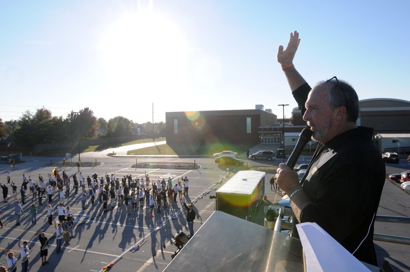 Scott Tomlinson, Bentonville High School band director, runs practice Oct. 24, 2013. Tomlinson is retiring this summer and Tim Hendrix, assistand band director, is taking his spot.