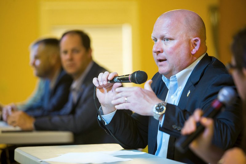 Rogers Police Chief Hayes Minor speaks Thursday during a community meeting for minority residents at Centro Cristiano Assemblies of God church in Rogers.