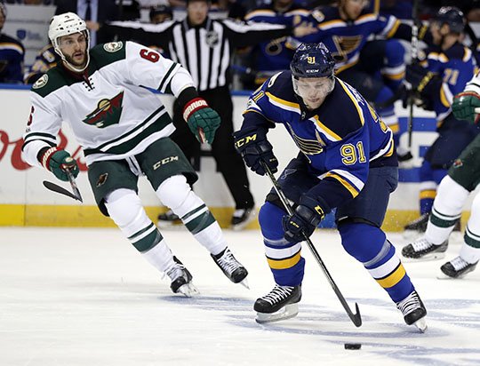 The Associated Press SIMPLY WILD: Vladimir Tarasenko brings the puck down the ice for St. Louis against Minnesota defender Marco Scandella, left, in Game 4 of their NHL first-round playoff series Wednesday night. Averting elimination with a 2-0 victory, the Minnesota Wild return home for Game 5 Saturday against the Blues.