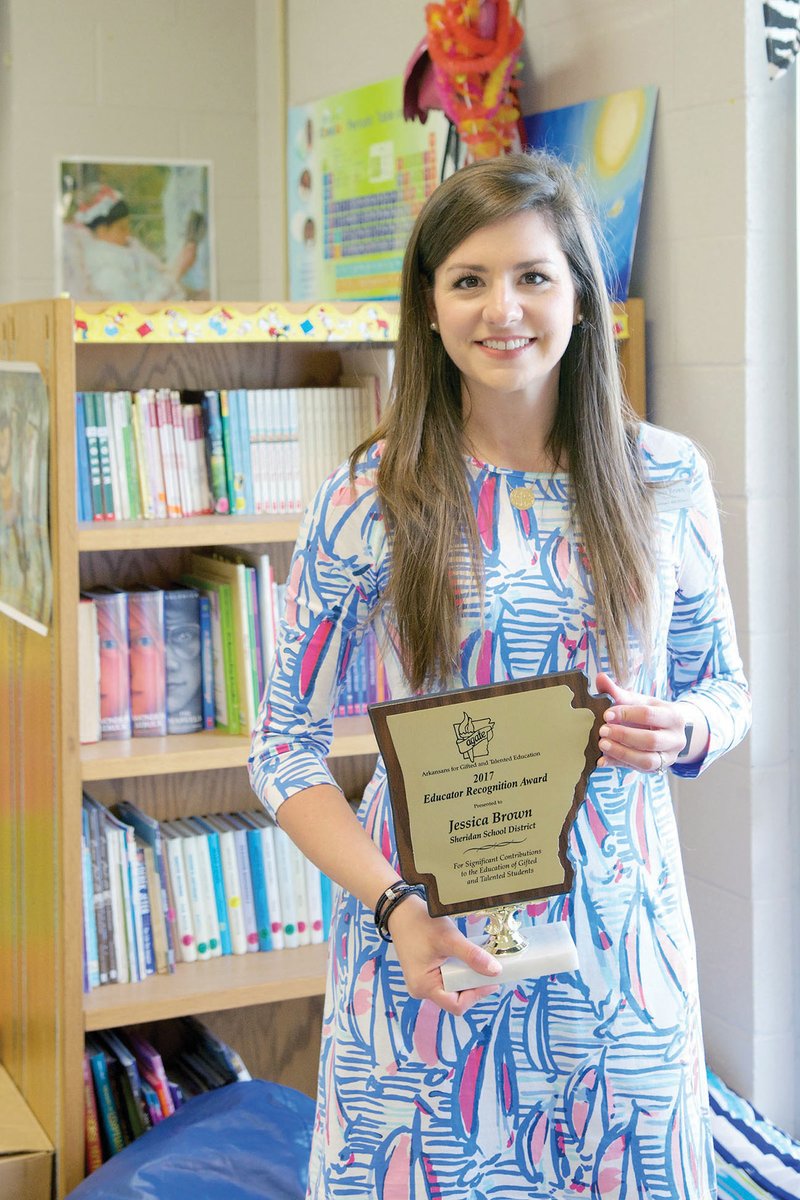 Jessica Brown, kindergarten through fifth-grade gifted and talented facilitator at East End Intermediate School, holds the award she received recently at the Arkansas for Gifted and Talented Education Educator Recognition Awards ceremony.
