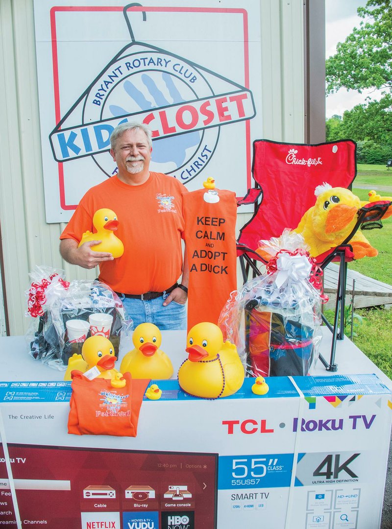 Bryant Rotary Club President David Hannah stands with some of the items available for the winners of the first ever Bryant Rotary Rubber Duck Derby. The derby will be May 6 at Mills Park in Bryant with proceeds going towards the Kids Closet, which clothes about 300 kids a year. 