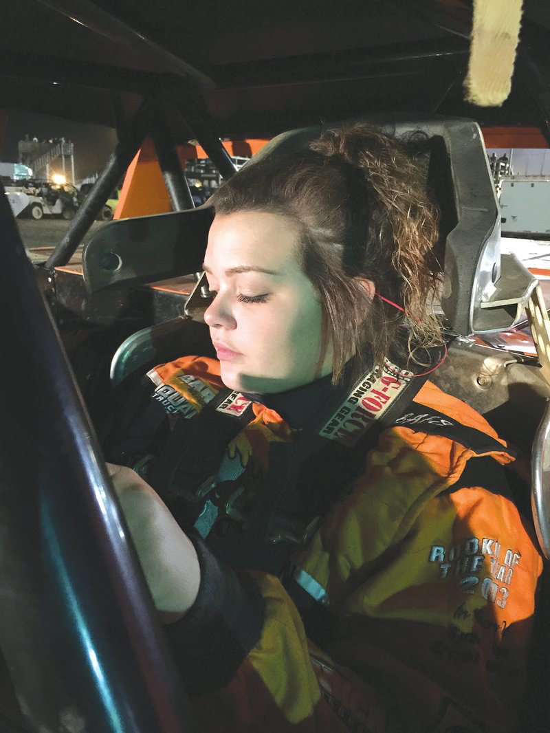 Rebekah Harris prays before a race to calm her nerves. Harris has donated more than $10,000 of her race winnings to support causes such as the Make-A-Wish Foundation and breast cancer research.