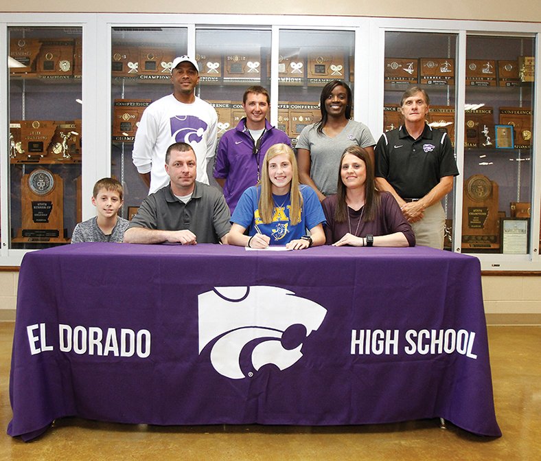 Terrance Armstard/News-Times El Dorado's Chloee Richard, center, signs to compete in cross country and track with Southern Arkansas University. She is seated next to her, from left, Austin Richard (brother), Forrest Richard (father) and April Richard (mother). Standing are coaches, Ken Cunningham, Blakely Sanders, Sharonda Brooks and El Dorado athletic director Phillip Lansdell.