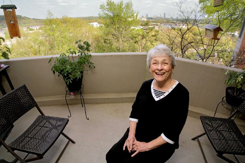 Barbara Burks Hanley in her favorite space, her balcony.
