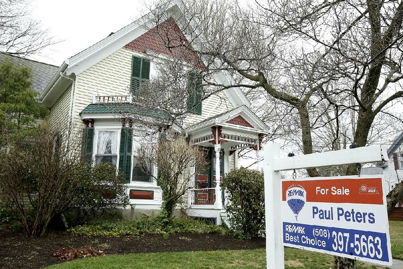 A home in Natick, Mass., waits for a buyer. Americans purchased homes in March at the fastest pace in more than a decade.