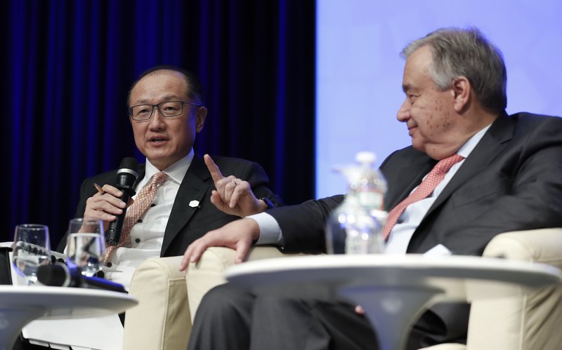 World Bank Group President Jim Yong Kim, left, joined by UN Secretary General Antonio Guterres, speaks at the "Financing For Peace: Innovations to Tackle Fragility" session during the G20 at the 2017 World Bank Group Spring Meetings in Washington, Friday, April 21, 2017.