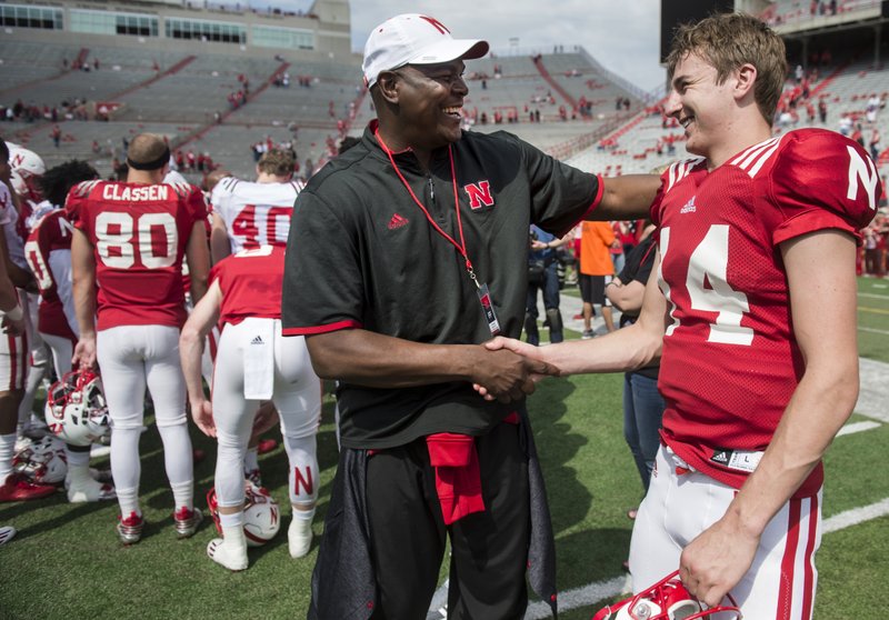 In this April 15, 2017, file photo, Keyshawn Johnson Sr., left, hugs Nebraska quarterback Tristan Gebbia after the NCAA college football team's spring game in Lincoln, Neb. (Jake Crandall/The Journal-Star via AP)