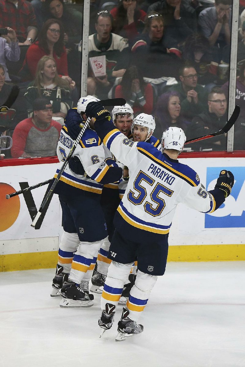 Joel Edmundson (left) Magnus Paajarvi (center) Jaden Schwartz (right) and Colton Parayko (55) celebrate after Paul Stastny scored in the third period to give the St. Louis Blues a 3-1 lead. After the Minnesota Wild scored twice to send the game to overtime, Paajarvi scored to give the Blues a 4-3 victory and eliminate the Wild from the NHL playoffs.