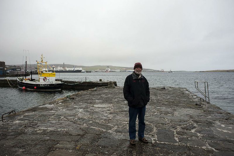 Stuart Hill stands on a jetty at Lerwick on Scotland’s Shetland Islands, which he says can become the epicenter of the “breakup of monolithic states.”