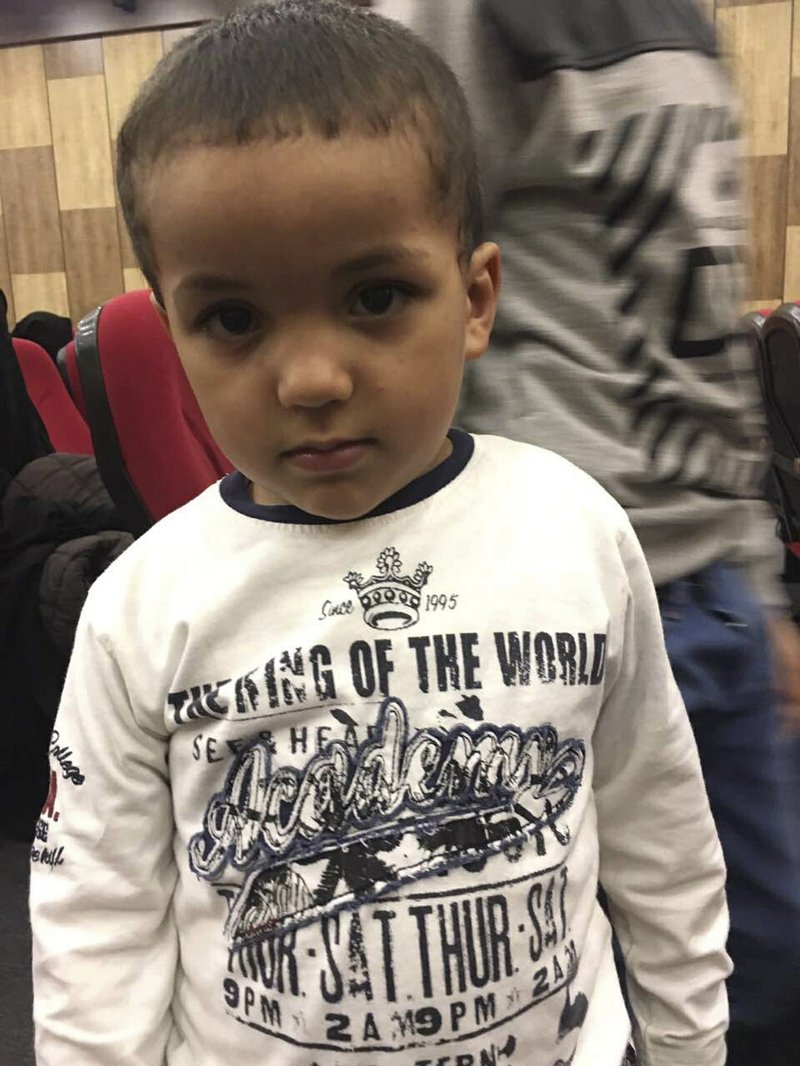 In this Wednesday, April 19, 2017 photo, in Tripoli, Libya, 2-year-old Tamim Jaboudi awaits a Tunisian government delegation that was turned away after trying to bring him home from a Libyan prison. The boy's parents, both Tunisians who left home to join the Islamic State group, died in an American airstrike on the city of Sabratha in February 2016. In custody ever since, he is among hundreds of children of Islamic State's foreign fighters to remain in limbo. 