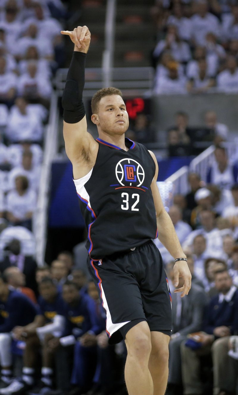 Los Angeles Clippers forward Blake Griffin follows through on a 3-point basket against the Utah Jazz during the first half in Game 3 of an NBA basketball first-round playoff series Friday, April 21, 2017, in Salt Lake City. 