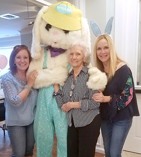 Submitted photo Fountain Lake Middle School Cobra Digital Prep Academy recently dressed as the Easter bunny and visited Brookfield Assistant Living to celebrate the holiday with, from left, Lynn Janaskie, resident Jo Litton and T.J. Griffith, a faculty member in the Health Sciences Division at National Park College.