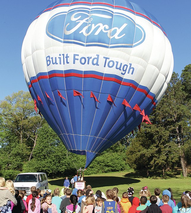 Submitted photo Rodney Williams, of Branson, Mo., worked to fill a seven-story tall custom-designed Ford hot air balloon April 7 at Lakeside Primary School. The balloon was sponsored in town by Riser Ford Lincoln.