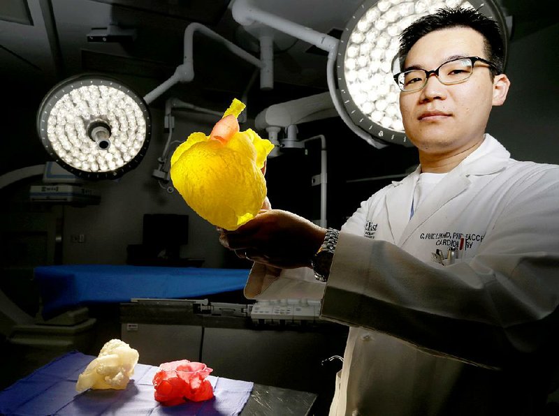 Earlier this month, Dr. C. Huie Lin, a specialist in adult congenital and interventional cardiology, displays a 3-D printed model of a patient’s heart at Houston Methodist Research Institute.