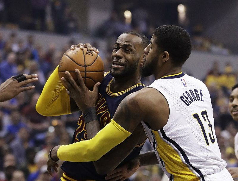 Cleveland forward LeBron James (left) has been a part of 21 consecutive victories in the first round of the NBA Eastern Conference playoffs after his 33 points helped the Cavaliers beat Indiana 106-102 on Sunday to complete a four-game sweep.