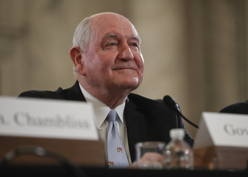 FILE - In this March 23, 2017 file photo, Agriculture Secretary-designate, former Georgia Gov. Sonny Perdue arrives to testify on Capitol Hill in Washington to testify at his confirmation hearing before the Senate Agriculture, Nutrition and Forestry Committee. 