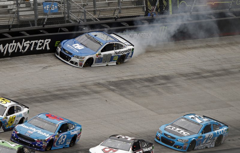 Dale Earnhardt Jr.(88) hits the wall as cars get past him during a NASCAR Monster Energy NASCAR Cup Series auto race, Monday, April 24, 2017, in Bristol, Tenn. (AP Photo/Wade Payne)
