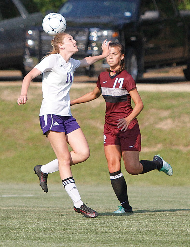 News-Times/Terrance Armstard El Dorado's Carson Henry tries to control the ball against Benton's Abby Walker. The Lady Panthers upended the Lady Wildcats 5-1 Tuesday at the El Dorado Soccer Complex.