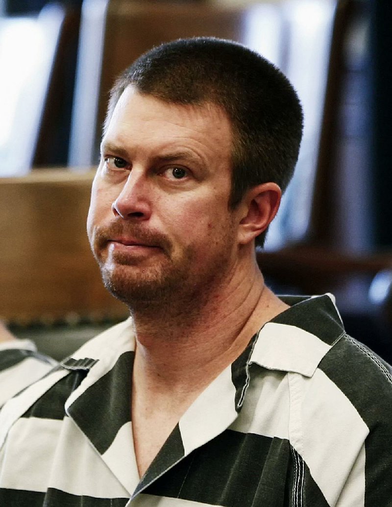  In this May 8, 2012, file photo, former NFL quarterback Ryan Leaf, center, sits in a Cascade County courtroom in Great Falls, Mont.